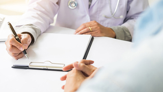 Doctor with pen and notepad