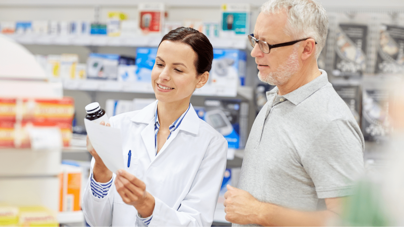 Female pharmacist and a male patient