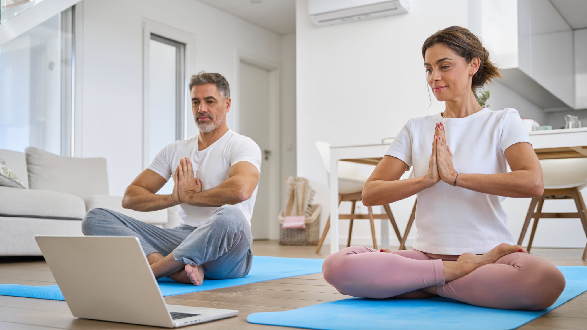 Man and woman practicing yoga