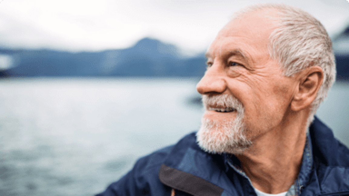 senior man with the sea as backgroung