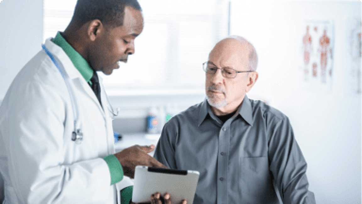 doctor talking to his elder patient