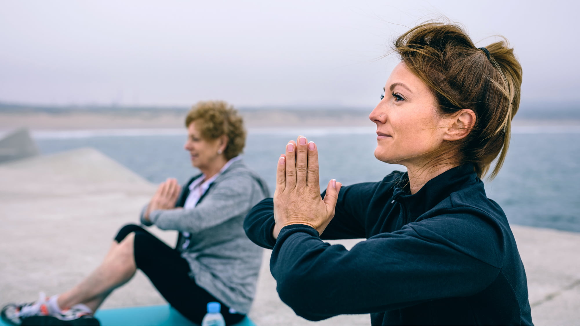 two ladies doing yoga