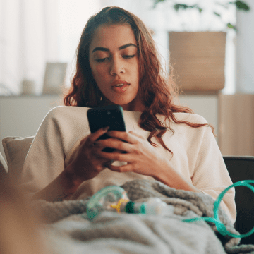 young woman holding a phone