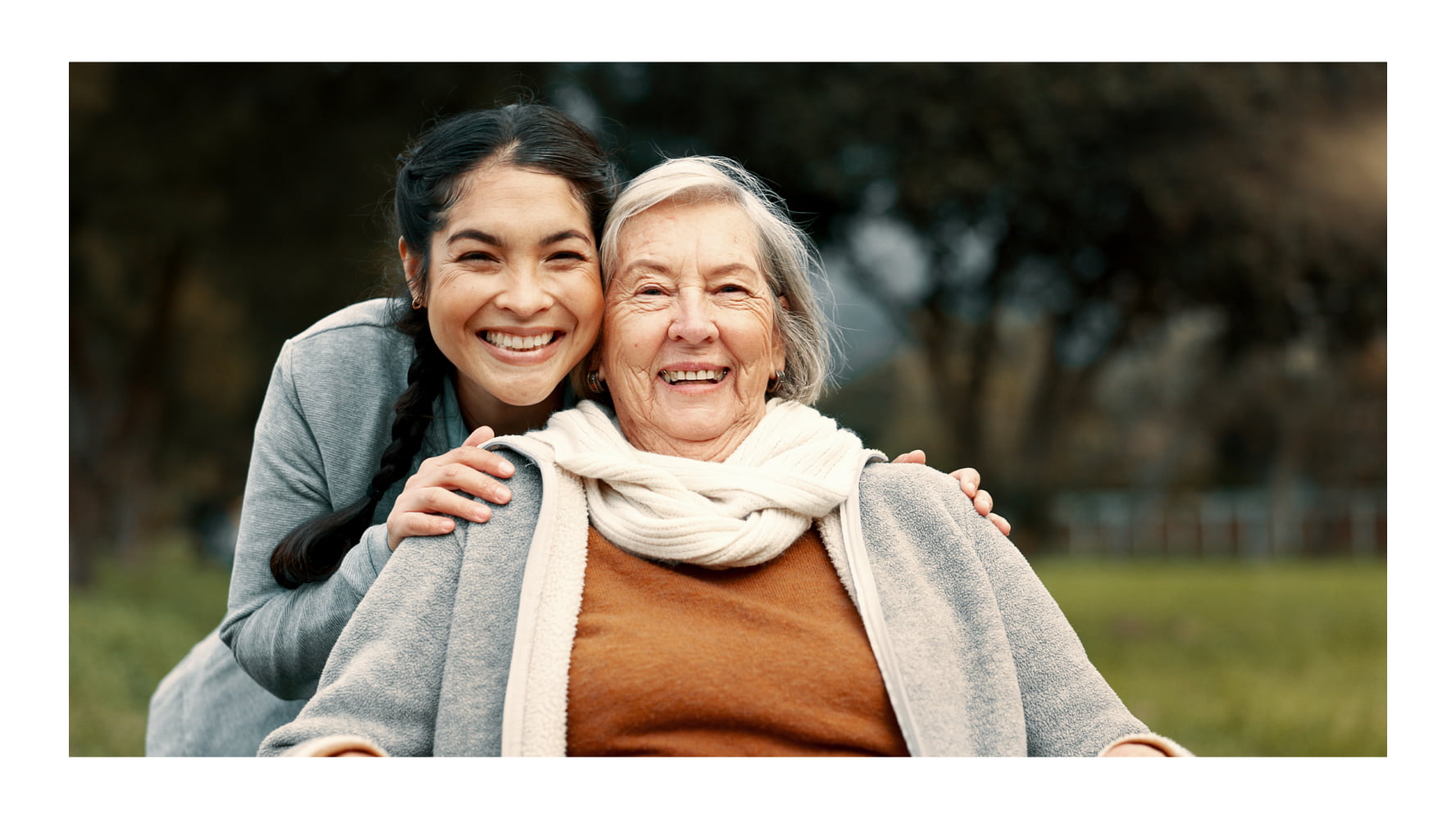 younger woman hugging an elder woman