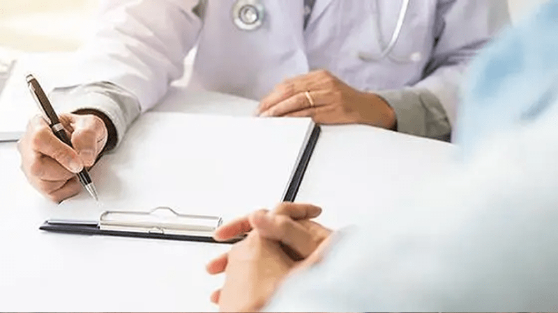 Doctor with pen and notepad