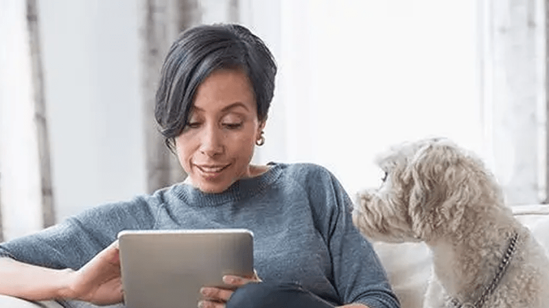 Female using tablet.