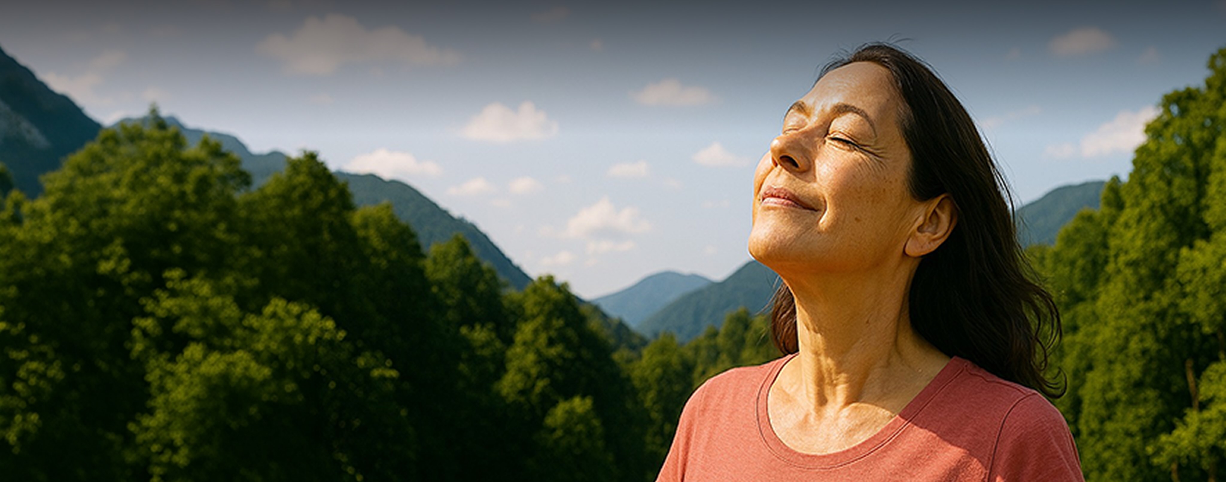Female breathing deeply in the mountains