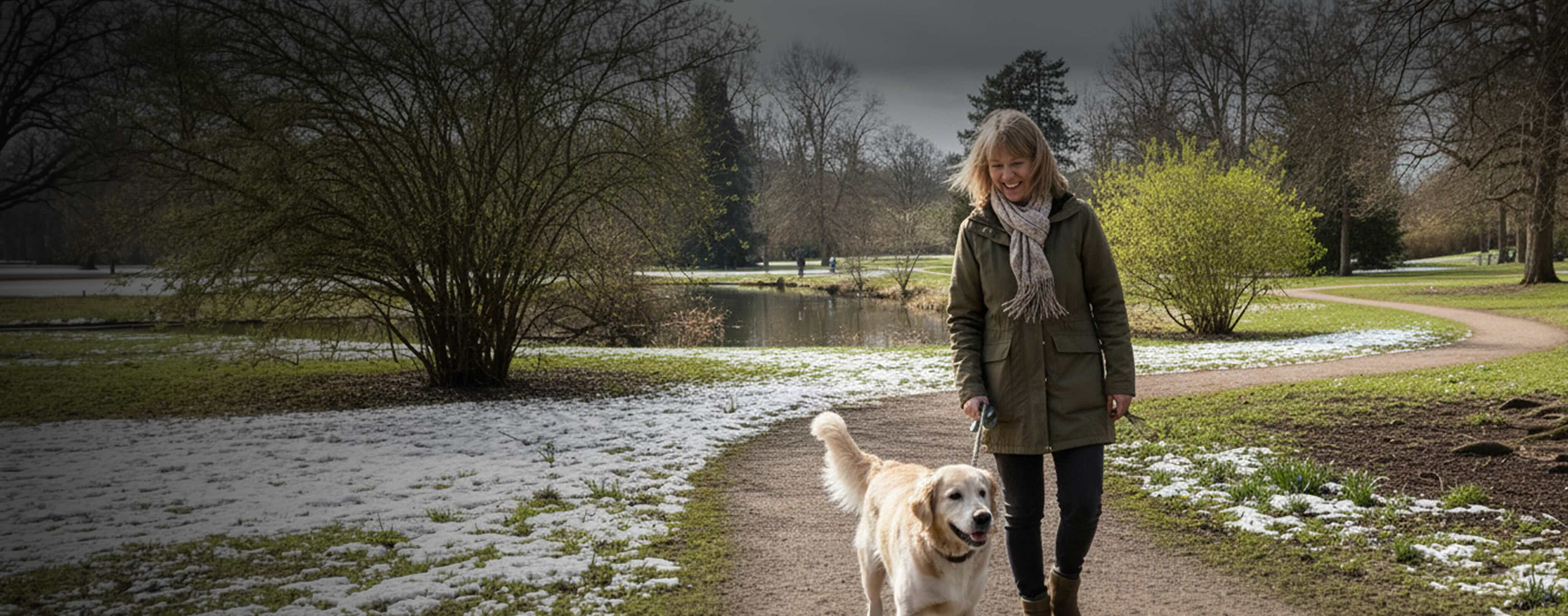 Old woman and her dog walking in nature