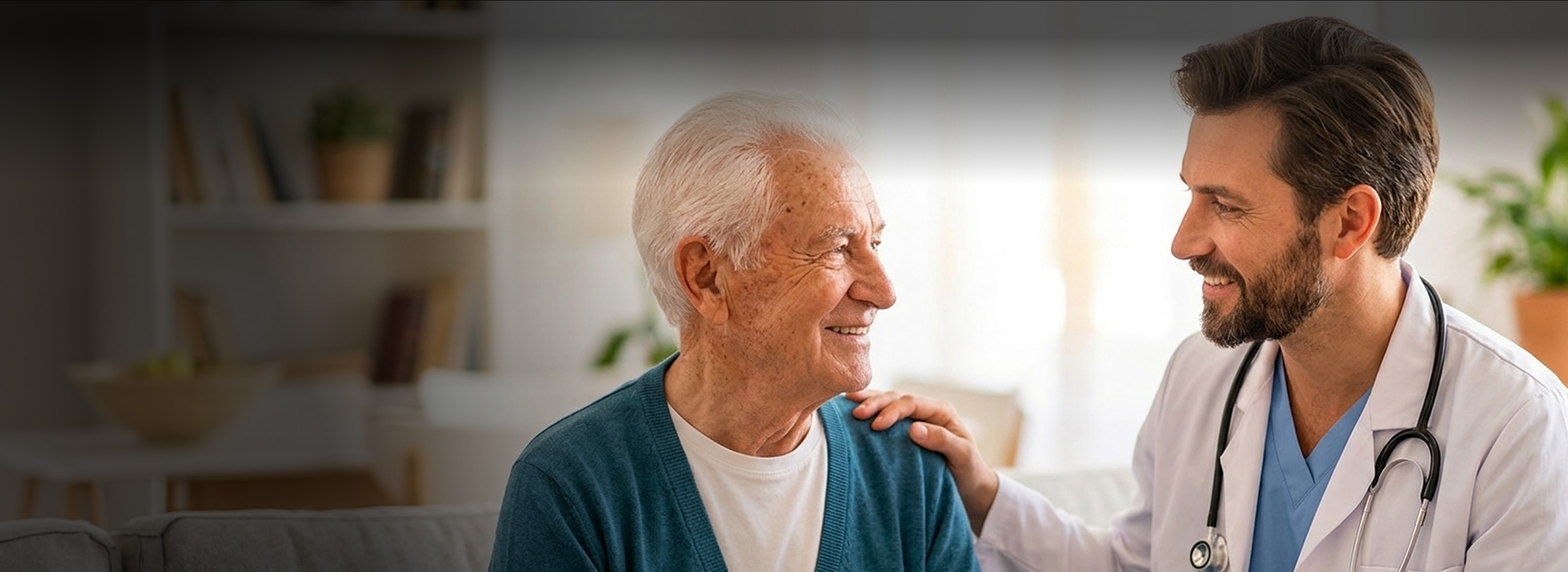 Male doctor smiling and placing a hand on a senior patient's shoulder
