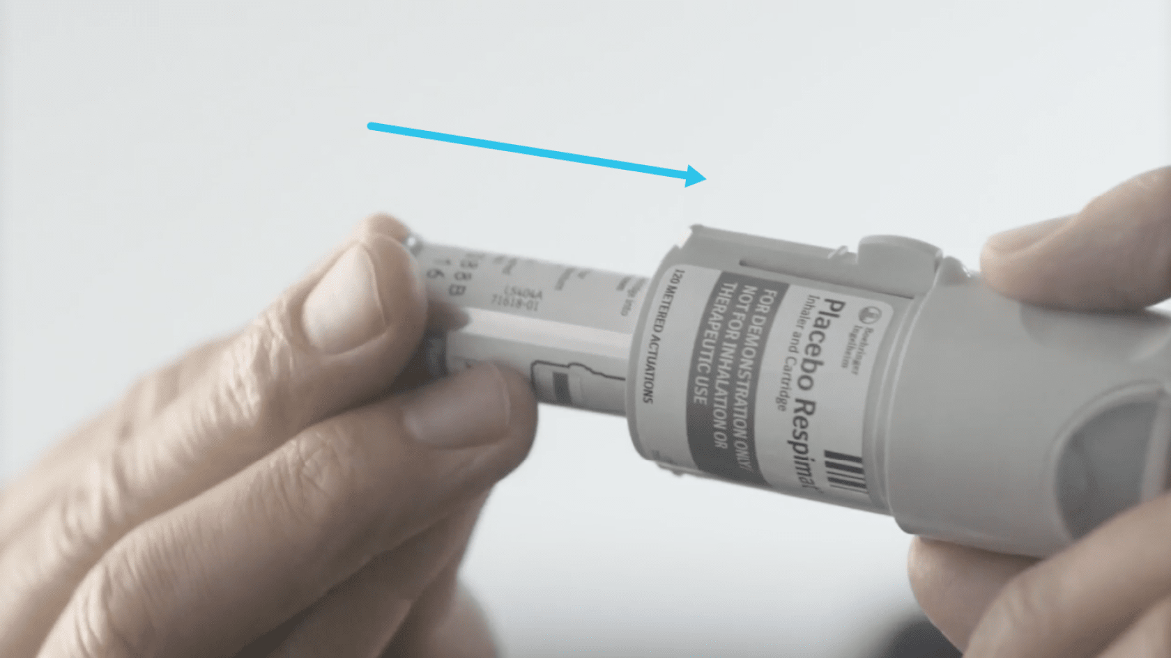 Hands inserting the medication cartridge into the Spiriva Respimat inhaler