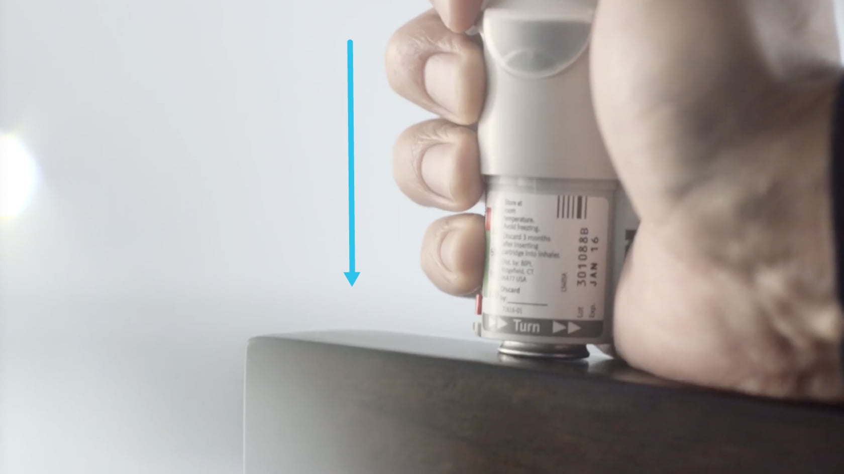 Pushing down the Spiriva Respimat cartridge against a firm surface to ensure it clicks into place