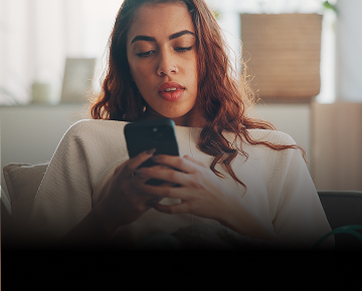 young woman holding a phone